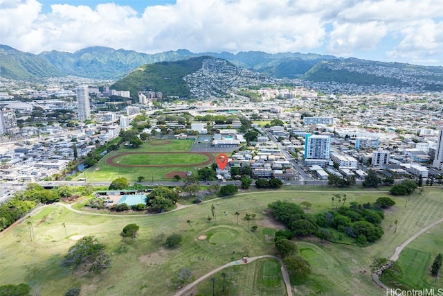 drone / aerial view with a mountain view and a city view