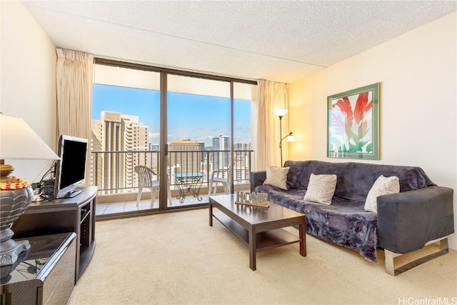 living room featuring a wall of windows, a textured ceiling, and carpet flooring