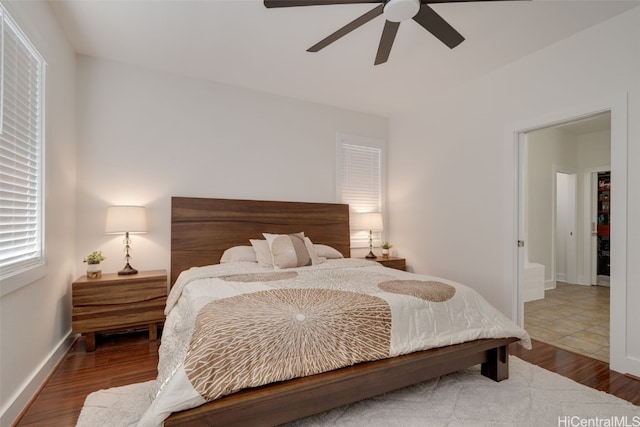 bedroom with hardwood / wood-style floors and ceiling fan