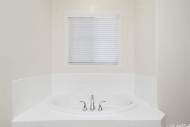 bathroom with tiled tub