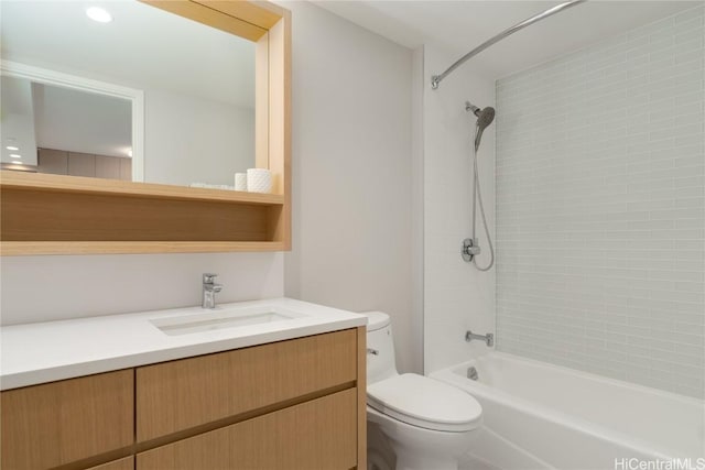 full bathroom with vanity, toilet, and tiled shower / bath combo