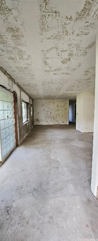 spare room with concrete floors