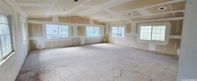 empty room featuring lofted ceiling