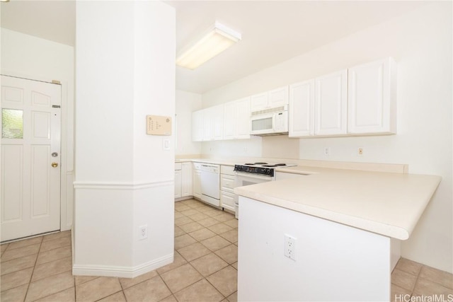 kitchen with white cabinetry, light tile patterned floors, white appliances, and kitchen peninsula