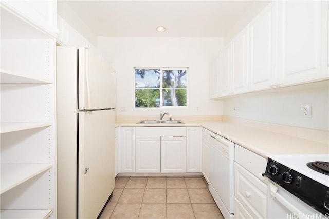 kitchen with white cabinetry, white appliances, sink, and light tile patterned floors