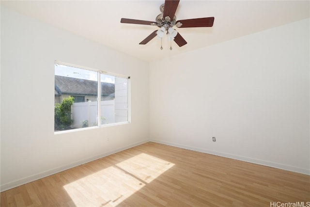 spare room with wood-type flooring and ceiling fan