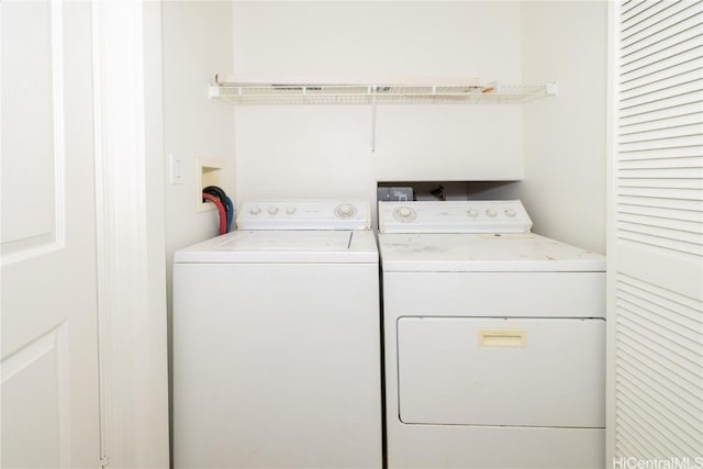 laundry room with independent washer and dryer