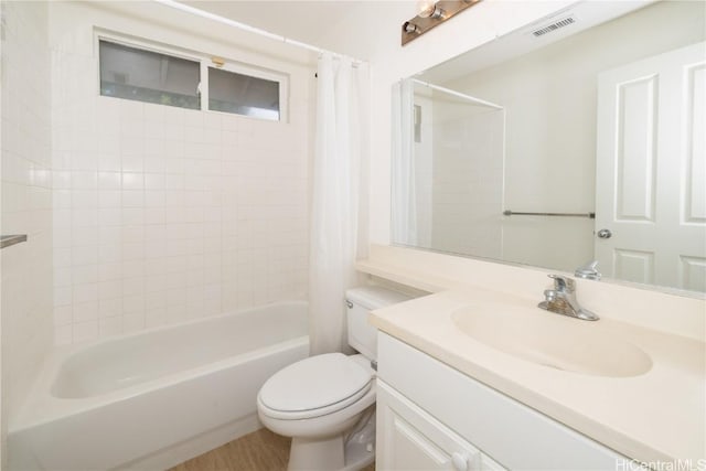 full bathroom featuring shower / bathtub combination with curtain, vanity, and toilet