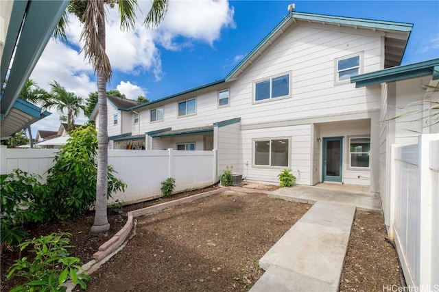 rear view of property featuring a patio