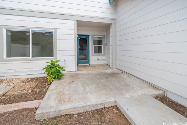 property entrance featuring a patio area