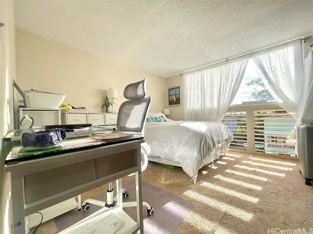 carpeted bedroom with a textured ceiling