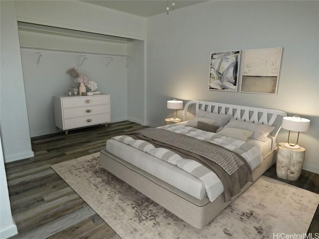 bedroom featuring dark wood-type flooring and a closet