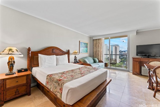 bedroom featuring light tile patterned floors, crown molding, and access to exterior