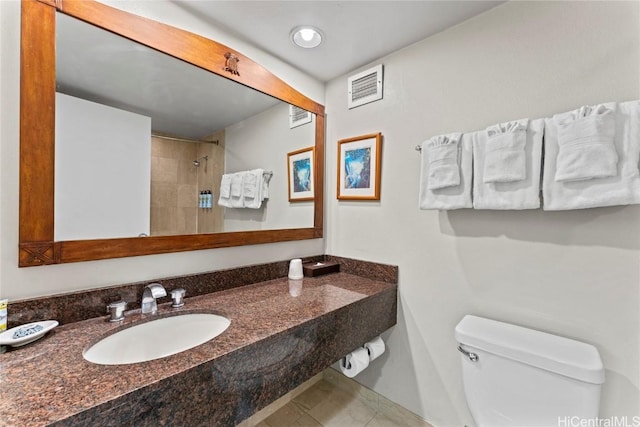 bathroom with toilet and sink