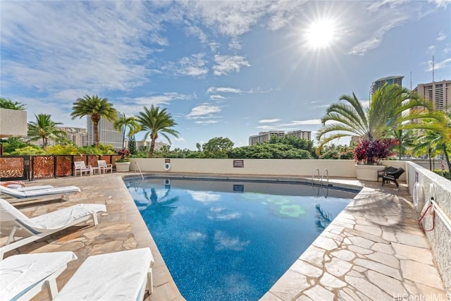 view of pool featuring a patio