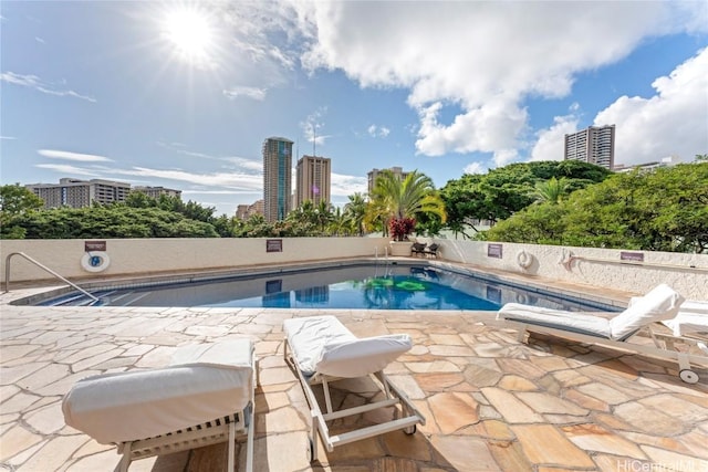 view of swimming pool featuring a patio