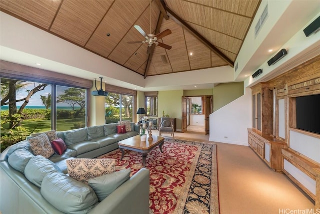 carpeted living room featuring high vaulted ceiling, beam ceiling, wooden ceiling, and ceiling fan