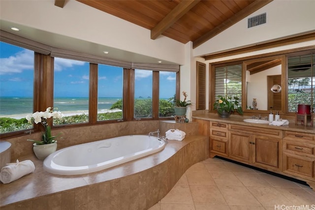 bathroom featuring a water view, vaulted ceiling with beams, wooden ceiling, and plenty of natural light