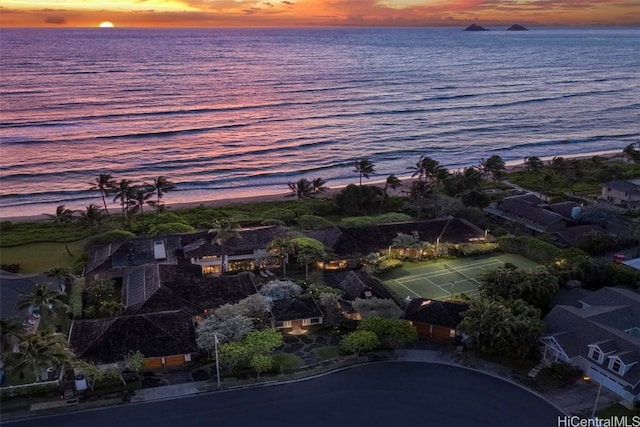 aerial view at dusk with a water view