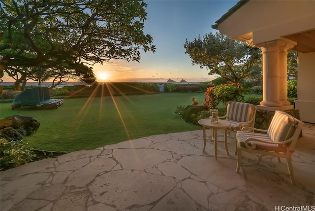 patio terrace at dusk with a yard