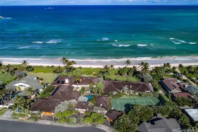 drone / aerial view with a water view and a view of the beach