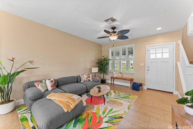 living area featuring recessed lighting, visible vents, baseboards, and a ceiling fan