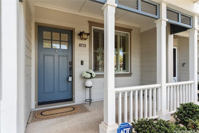 entrance to property featuring covered porch