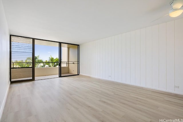 spare room featuring light wood-type flooring