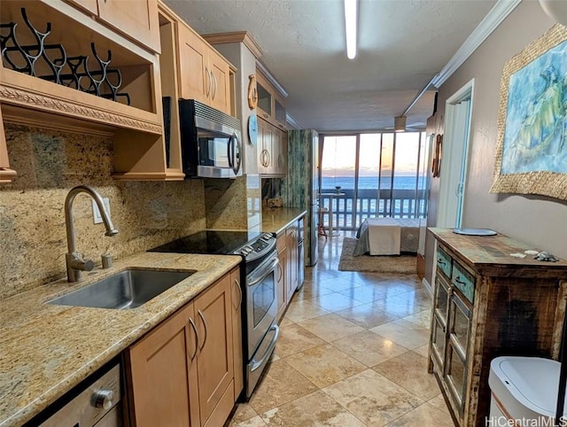 84-965 Farrington Hwy Unit A604, Waianae, HI 96792 - kitchen featuring sink, a wall of windows, stainless steel appliances, light stone counters, and decorative backsplash
