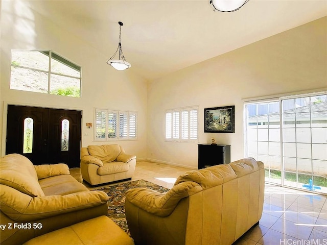 tiled living room featuring high vaulted ceiling