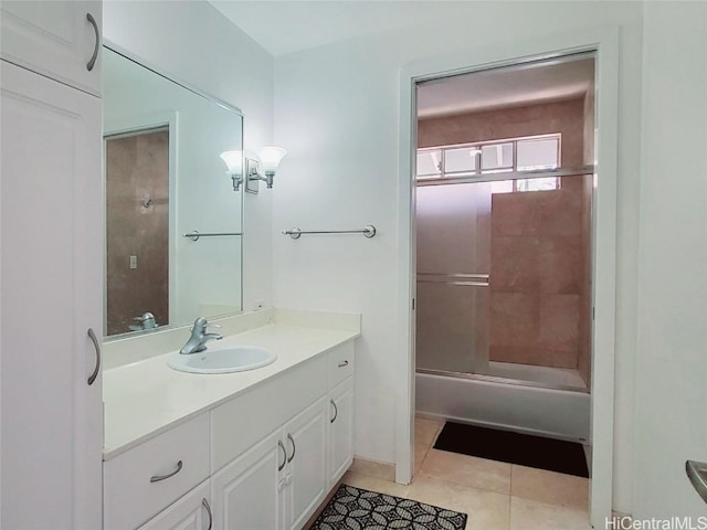 bathroom with vanity, tile patterned flooring, and bathtub / shower combination