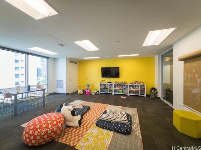 game room featuring expansive windows