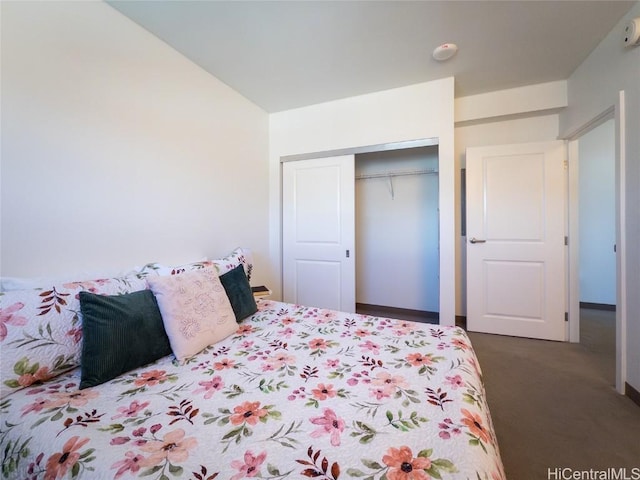 carpeted bedroom featuring a closet