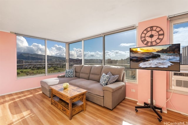 sunroom featuring a wall mounted air conditioner