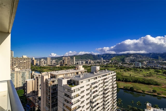 exterior space with a water and mountain view