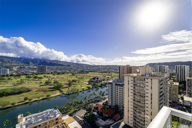 exterior space with a water view and a city view