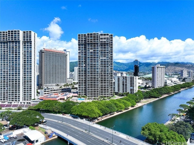 city view featuring a water and mountain view