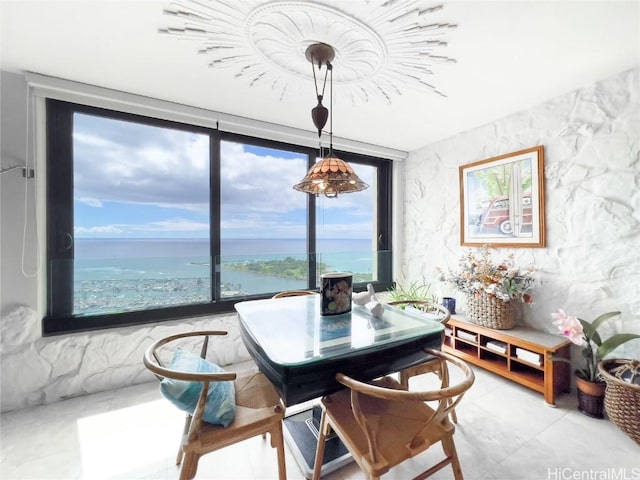 dining space with a water view