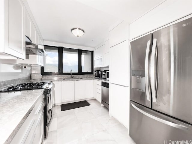 kitchen with sink, stainless steel appliances, and white cabinets