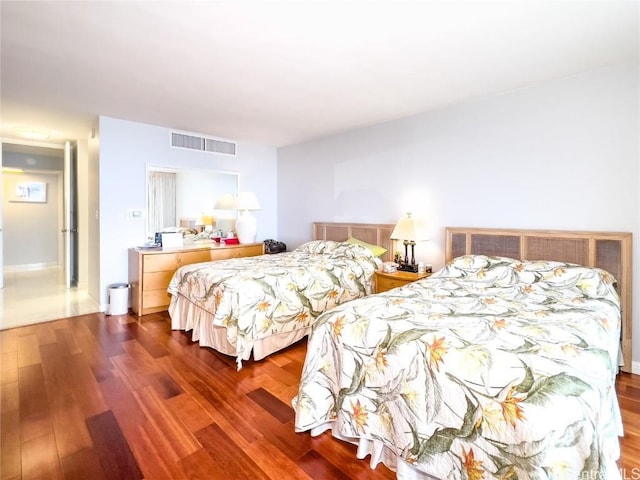 bedroom featuring dark hardwood / wood-style floors