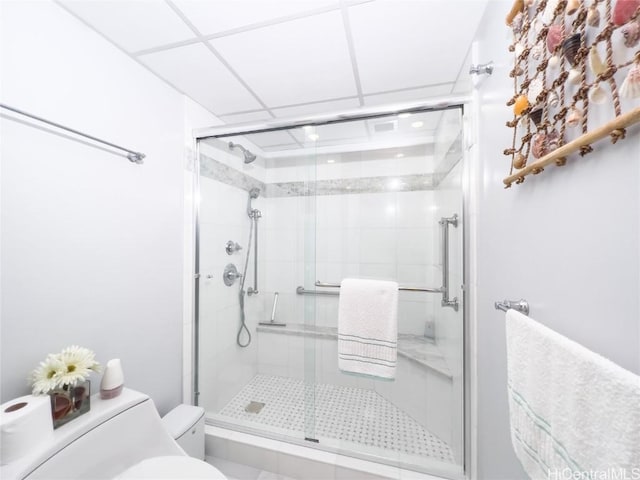 bathroom with an enclosed shower and toilet