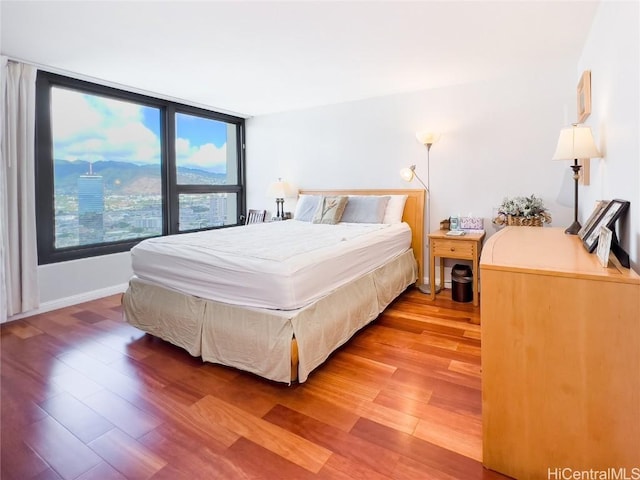 bedroom with wood-type flooring