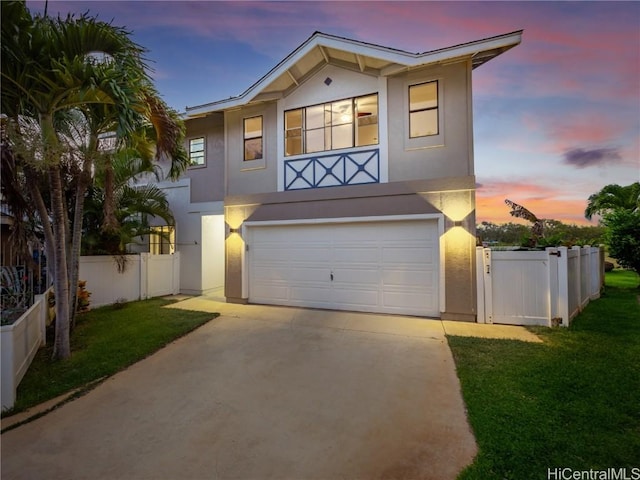 view of front of home featuring a yard and a garage