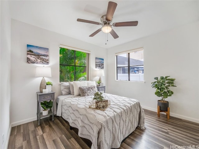 bedroom featuring ceiling fan and dark hardwood / wood-style floors