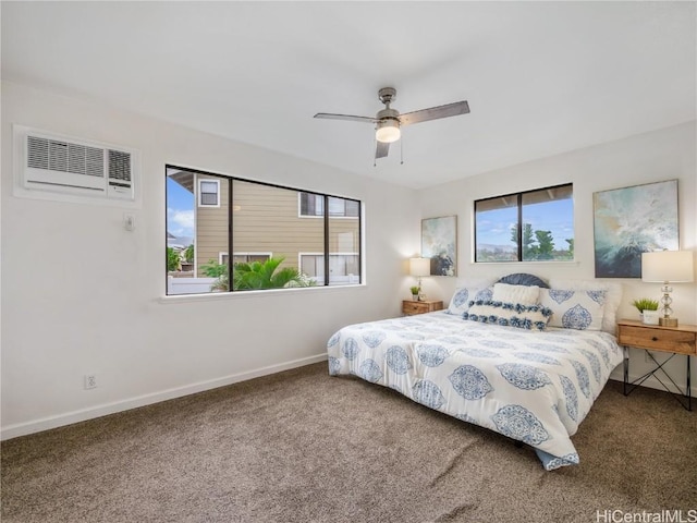 carpeted bedroom with ceiling fan and a wall mounted AC