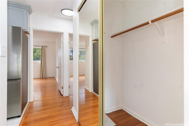 hallway with light hardwood / wood-style flooring