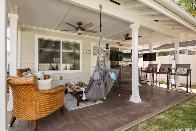 view of patio with ceiling fan and a deck