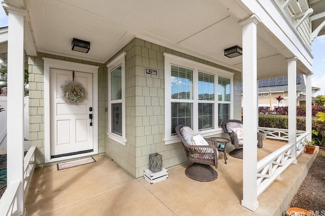 doorway to property featuring a porch