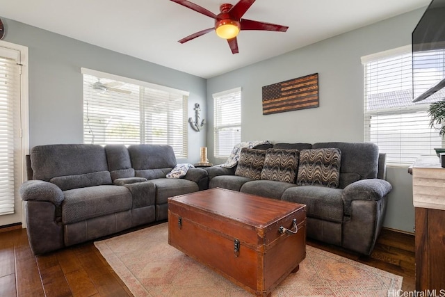 living room with hardwood / wood-style flooring and ceiling fan