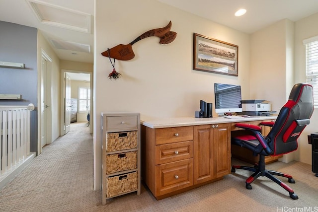 carpeted home office with plenty of natural light